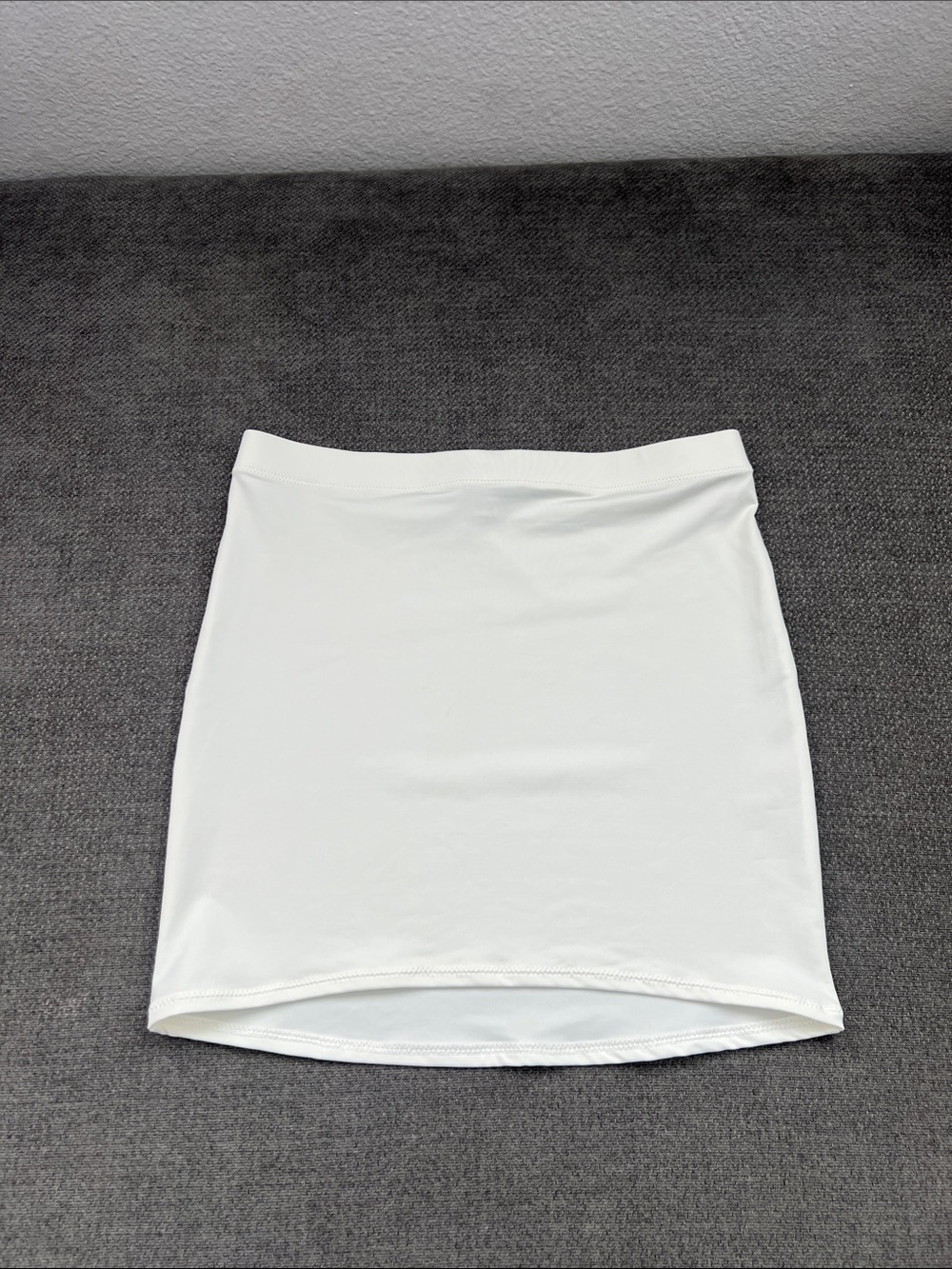 SKIMS White Stretch Mini Skirt — Clean Minimal Silhouette